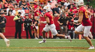 Iowa State quarterback rolls out for a pass attempt. (Photo by ISU Athletics)