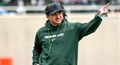 Michigan State's head coach Jonathan Smith communicates with staff on Saturday, April 20, 2024, at Spartan Stadium in East Lansing - Nick King, USA TODAY Sports