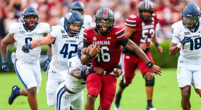 Aug 31, 2024; Columbia, South Carolina, USA; South Carolina Gamecocks quarterback LaNorris Sellers (16) is tackled by Old Dominion Monarchs safety Jahron Manning (5) in the first quarter at Williams-Brice Stadium. Mandatory Credit: Jeff Blake-USA TODAY Sports