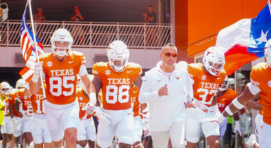 Texas HC Steve Sarkisian leads the Longhorns out of the tunnel against Colorado State