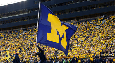 Michigan Maize Out tunnel The Big House crowd flag