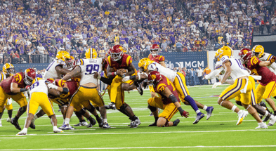 USC running back Woody Marks breaks through the LSU defensive line on his way to a touchdown for the Trojans