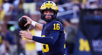 Michigan quarterback Davis Warren had ups and downs vs. Texas, coach Sherrone Moore said. © Rick Osentoski-Imagn Images