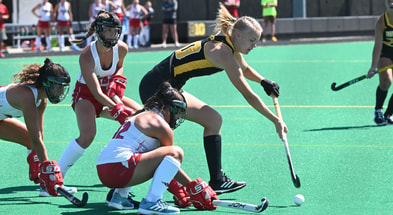 Iowa forward Dionne van Aalsum handles the ball against a Miami Ohio defender (Photo by Dennis Scheidt)