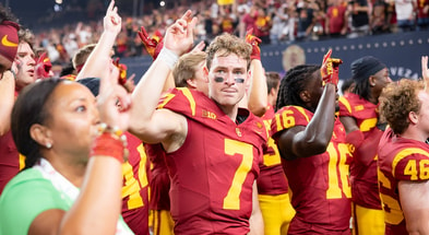 USC quarterback Miller Moss and his Trojans teammates celebrate following a win against the LSU Tigers