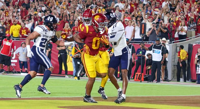 USC running back Quinten Joyner goes into the endzone for a touchdown against the Utah State Aggies