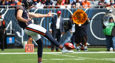 Chicago Bears punter Tory Taylor (19) punts the ball against the Tennessee Titans (Photo by Mike Dinovo-Imagn Images)