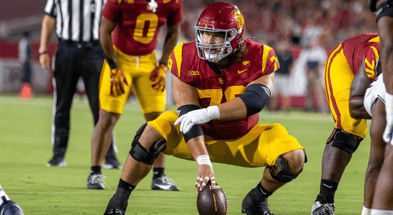 USC center Jonah Monheim prepares to snap the ball for the Trojans against Utah State
