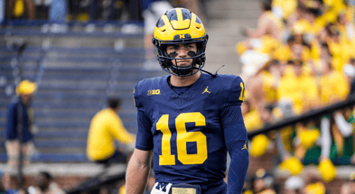 Michigan Wolverines football quarterback Davis Warren struggled against Arkansas State. (Photo by Junfu Han / USA TODAY NETWORK)