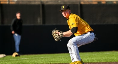 Iowa Baseball infielder Gable Mitchell fields a baseball during team media day at Duane Banks Field. (Photo by Dennis Scheidt)