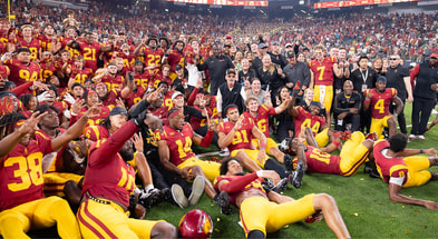 The USC Trojans pose for a team photo following a season-opening win against the LSU Tigers at Allegiant Stadium in Las Vegas