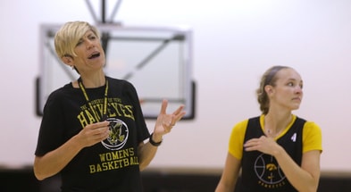Head Coach Jan Jensen coaches her team during a practice. (Photo by Julia Hansen/Iowa City Press-Citizen)