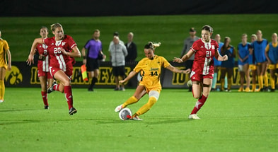 Iowa midfielder Meike Ingles takes a long distance shot against Nebraska. (Photo by Dennis Scheidt)