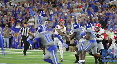 Kentucky's defense tries to make a play vs. Georgia quarterback Carson Beck - Dr. Michael Huang, Kentucky Sports Radio