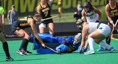 Hawkeyes battle for a ball in front of the Delaware goal. (Photo by Dennis Scheidt)