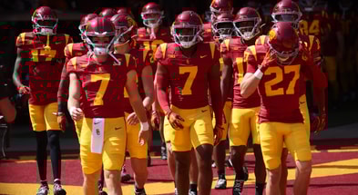 The USC Trojans walk out of the Coliseum tunnel ahead of a game against the Wisconsin Badgers