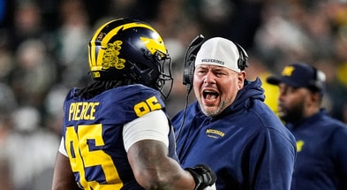 Michigan Wolverines football DT Trey Pierce with position coach Lou Esposito. (Photo by Junfu Han / USA TODAY NETWORK via Imagn Images)