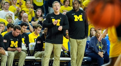 Michigan head coach Dusty May, center, and assistant coach Mike Boynton Jr. react to a play against Cleveland State during the second half at Crisler Center in Ann Arbor on Monday, Nov. 4, 2024. (Junfu Han/USA Today Syndication)
