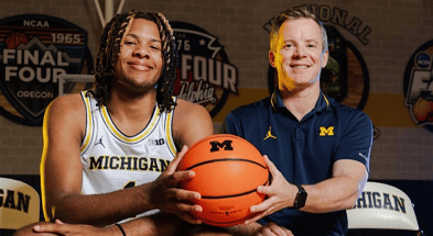 Five-star SG Trey McKenney with Michigan head coach Dusty May (photo credit - Michigan MBB)
