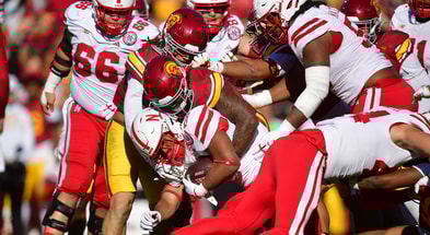 Nebraska Cornhuskers running back Dante Dowdell (23) is brought down against the Southern California Trojans defense during the first half at the Los Angeles Memorial Coliseum