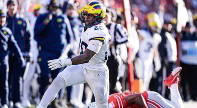 Michigan running back Kalel Mullings (20) runs against Ohio State safety Caleb Downs (2)during the second half at Ohio Stadium in Columbus, Ohio on Saturday, Nov. 30, 2024. (Columbus Dispatch)
