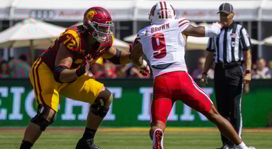 USC offensive lineman Elijah Paige blocks a Wisconsin defender during a game between the Trojans and Badgers