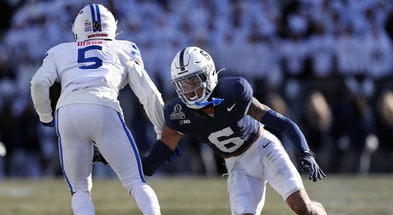 Penn State Nittany Lions safety Zakee Wheatley (6) attempts to tackle Southern Methodist Mustangs wide receiver Moochie Dixon (5) during the second quarter in the first round of the College Football Playoff at Beaver Stadium. (Mandatory Credit: Matthew O'Haren-Imagn Images)