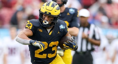 Dec 31, 2024; Tampa, FL, USA; Michigan Wolverines running back Jordan Marshall (23) runs with the ball against the Alabama Crimson Tide in the first quarter during the ReliaQuest Bowl at Raymond James Stadium. Mandatory Credit: Nathan Ray Seebeck-Imagn Images