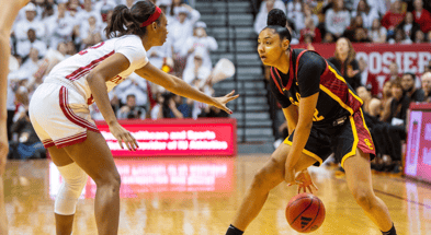 USC's JuJu Watkins (12) works against Indiana's Chloe Moore-McNeil (22) during the Indiana versus University of Southern California women's basektball game at Simon Skjodt Assembly Hall on Sunday, Jan. 19, 2025