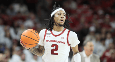 Jan 11, 2025; Fayetteville, Arkansas, USA; Arkansas Razorbacks guard Boogie Fland (2) dribbles during the first half against the Florida Gators at Bud Walton Arena. Mandatory Credit: Nelson Chenault-Imagn Images
