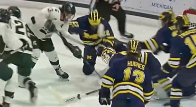 Michigan State's Tiernan Shoudy is turned away as he tries to jam the puck past Michigan goalie Cameron Korpi in the first period.