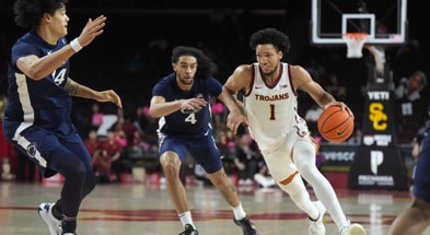 USC Trojans guard Desmond Claude (1) dribbles the ball against Penn State Nittany Lions guard Freddie Dilione V (4) and forward Zach Hicks (24) in the second half at Galen Center