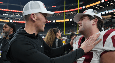 USC Trojans head coach Lincoln Riley embraces offensive lineman Kilian O'Connor (67) after the game against the Texas A&M Aggies at Allegiant Stadium