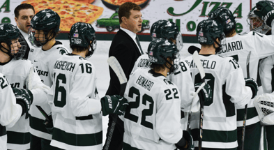 MSU hockey coach Adam Nightingale and his Spartans gather on the ice following MSU's 4-3 win over Notre Dame, Saturday, Nov. 15, 2024 -Matthew Dae Smith, USA TODAY Sports