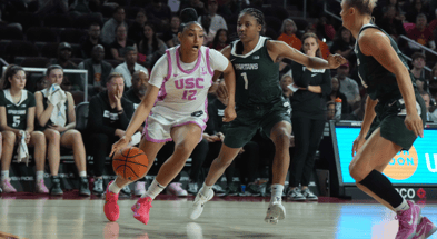 USC Trojans guard JuJu Watkins (12) dribbles the ball against Michigan State Spartans guard Jaddan Simmons (1) in the first half at Galen Center