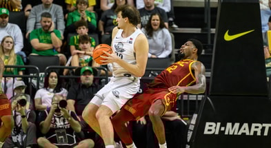 Oregon Ducks center Nate Bittle (32) drives to the basket against USC Trojans forward Rashaun Agee (12) during the second half at Matthew Knight Arena