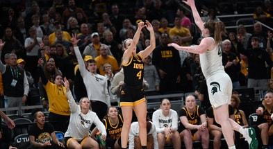 Iowa guard Kylie Feuerbach makes a three-pointer against Michigan State at the Big Ten Tournament. (Photo by Dennis Scheidt)
