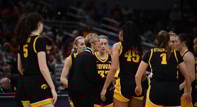 The Iowa women's basketball team huddles during the first half against Ohio State at the Big Ten Tournament. (Photo by Dennis Scheidt)