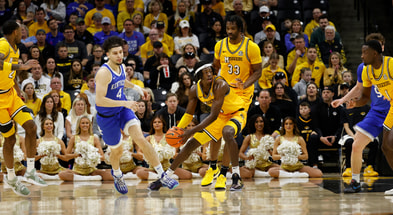 Mar 8, 2025; Columbia, Missouri, USA; Missouri Tigers guard Anthony Robinson II (0) gets the rebound in the first half against Kentucky at Mizzou Arena. Mandatory Credit: Gary Rohman-Imagn Images