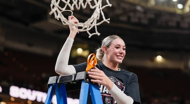 South Carolina Gamecocks forward Chloe Kitts (21) cuts the net after the win over Texas in the SEC women’s championship at Bon Secours Wellness Arena. Mandatory Credit: Jim Dedmon-Imagn Images