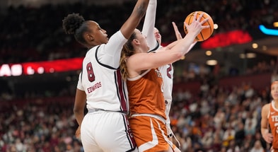 exas Longhorns forward Taylor Jones (44) goes up for a shot surrounded by South Carolina Gamecocks forward Joyce Edwards (8) and forward Chloe Kitts (21) during the first half at Bon Secours Wellness Arena. Mandatory Credit: Jim Dedmon-Imagn Images