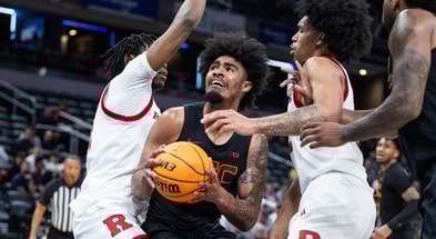 USC Trojans forward Saint Thomas (0) shoots the ball while Rutgers Scarlet Knights guard Dylan Harper (2) defends in the first half at Gainbridge Fieldhouse