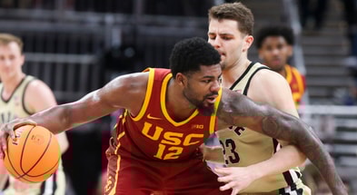 USC Trojans forward Rashaun Agee (12) is defended by Purdue Boilermakers forward Camden Heide (23) Thursday, March 13, 2025, during the Big Ten Men’s Basketball Tournament game at Gainbridge Fieldhouse in Indianapolis. Purdue Boilermakers won 76-71