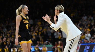 Head coach Jan Jensen encourages guard Kylie Feuerbach against USC. (Photo by Dennis Scheidt)