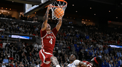 Mar 20, 2025; Providence, RI, USA; Arkansas Razorbacks forward Trevon Brazile (4) makes a basket against Kansas Jayhawks during the second half at Amica Mutual Pavilion. Mandatory Credit: Eric Canha-Imagn Images