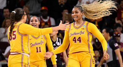USC Trojans forward Kiki Iriafen (44) celebrates with Talia von Oelhoffen (55) and Kennedy Smith (11) after scoring in the third quarter against the Mississippi State Bulldogs during an NCAA Tournament second round game at Galen Center