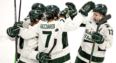 Michigan State's Matt Basgall, left, celebrates his goal with teammates David Gucciardi, center, and Tiernan Shoudy during the first period in the game against Minnesota on Saturday, Jan. 25, 2025. - Nick King, USA TODAY Sports