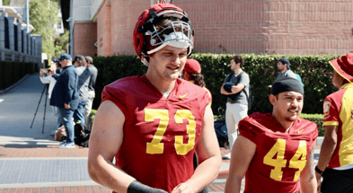 USC offensive tackle Tobias Raymond walks out to a spring practice with the Trojans