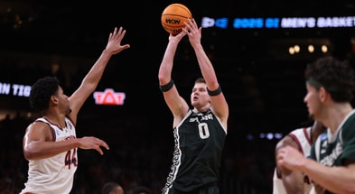 Michigan State Spartans forward Jaxon Kohler (0) shoots against Auburn Tigers center Dylan Cardwell (44) during the second half in the South Regional final of the 2025 NCAA tournament at State Farm Arena. - Brett Davis, USA TODAY Sports