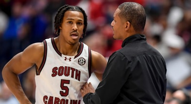 Mar 14, 2024; Nashville, TN, USA; South Carolina Gamecocks head coach Lamont Paris talks with guard Meechie Johnson (5) against the Arkansas Razorbacks during the first half at Bridgestone Arena. Mandatory Credit: Steve Roberts-Imagn Images